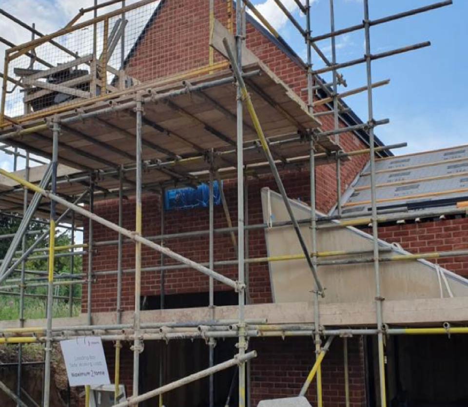 Red brick home under construction